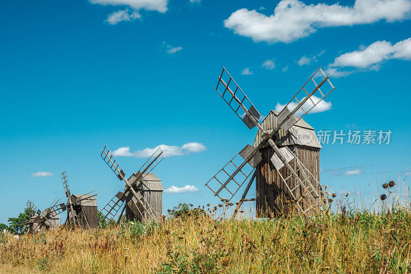 Characteristic landscape on the island of Öland (Sweden) with old wooden mill. This location is Störlinge Kvarnrad: a row of seven windmills on the eastern coastal road.